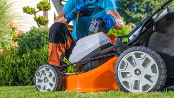 Electric lawnmower showing battery